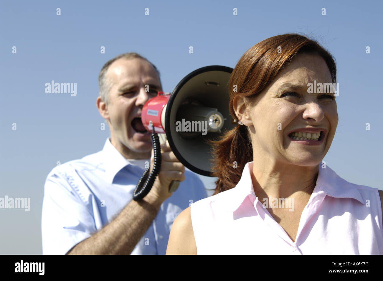 Man shouting through megaphone Stock Photo Alamy