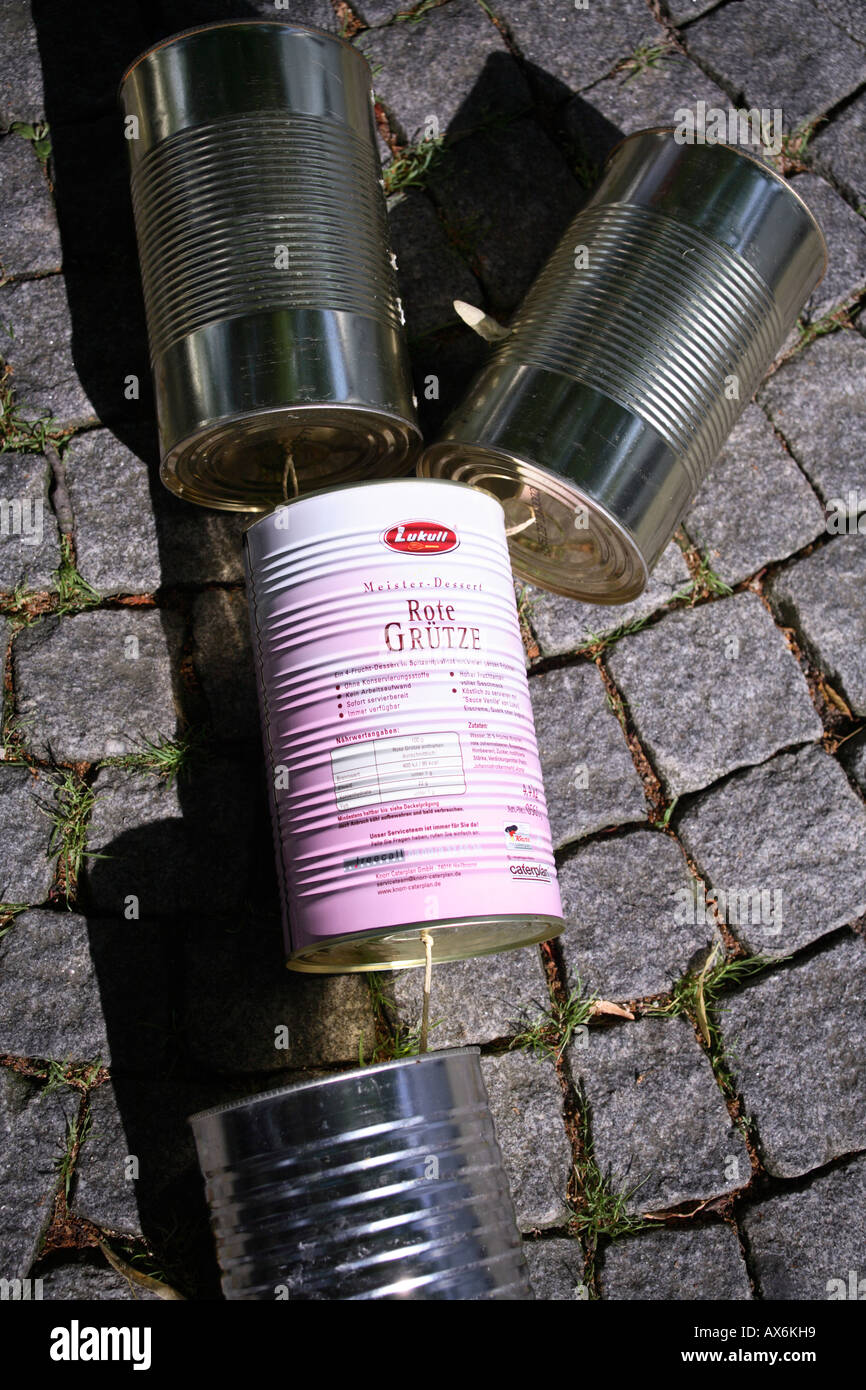close up of empty tin cans behind a car after marriage-ceremony in church. germany, europe Stock Photo