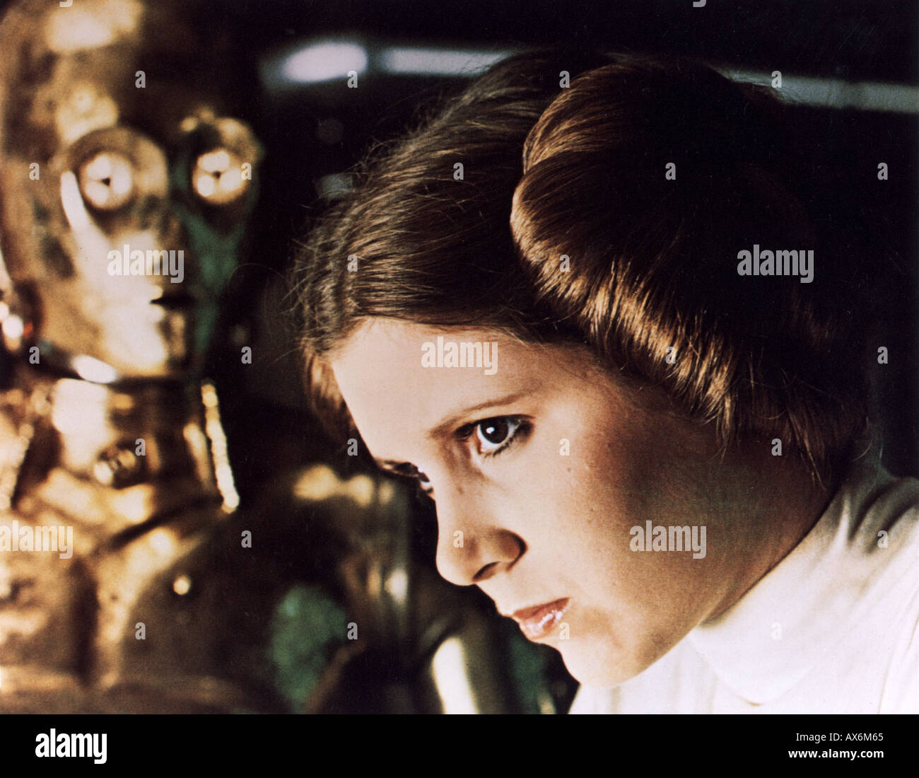 1977 TCF/Lucas film starring Carrie Fisher as Princess Leia Organa here with See Threepio played by Anthony Daniels Stock Photo