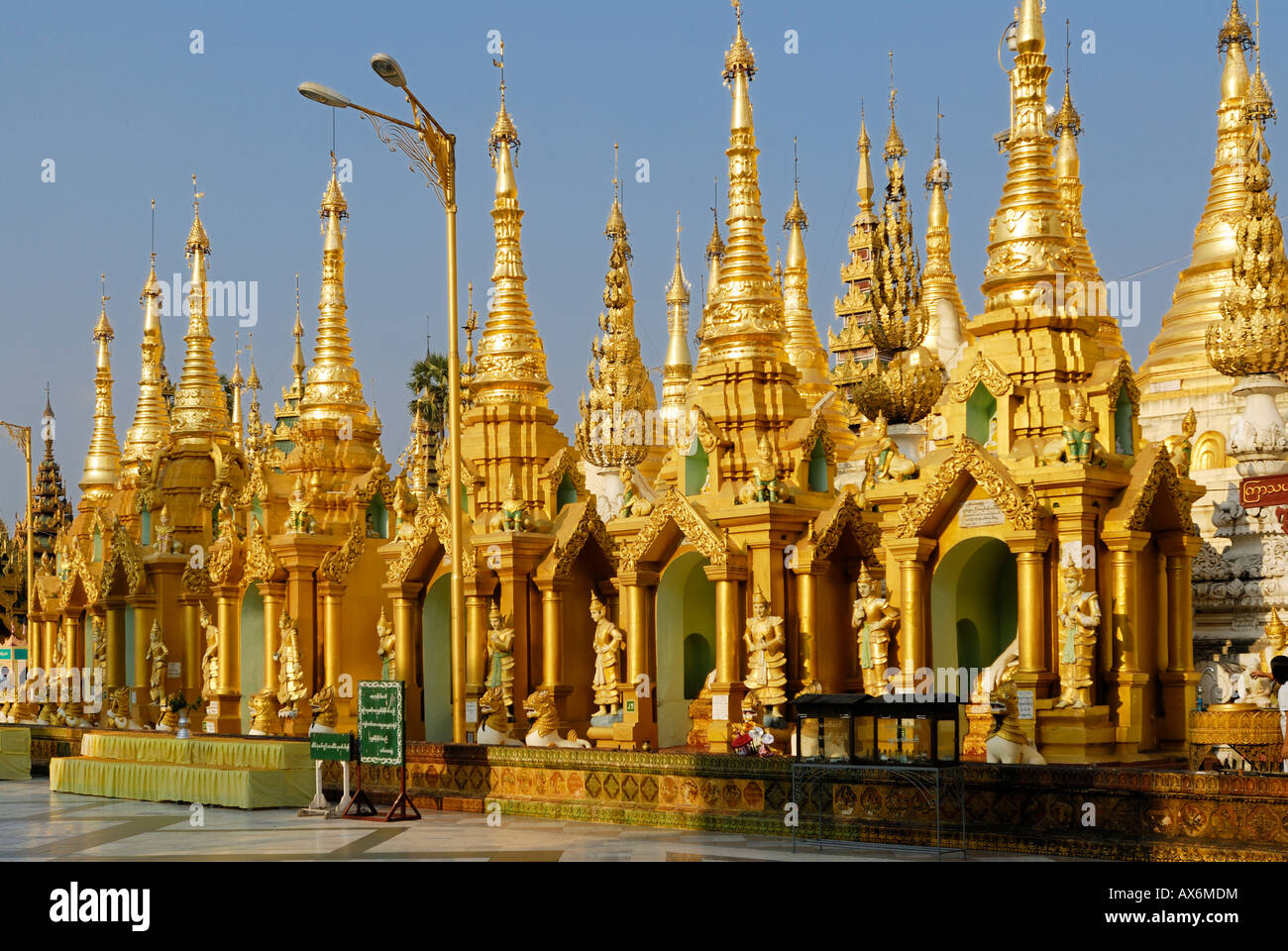 Golden Pagodas At Buddhist Temple Shwedagon Pagoda Yangon Myanmar golden-pagodas-at-buddhist-temple-shwedagon-pagoda-yangon-myanmar