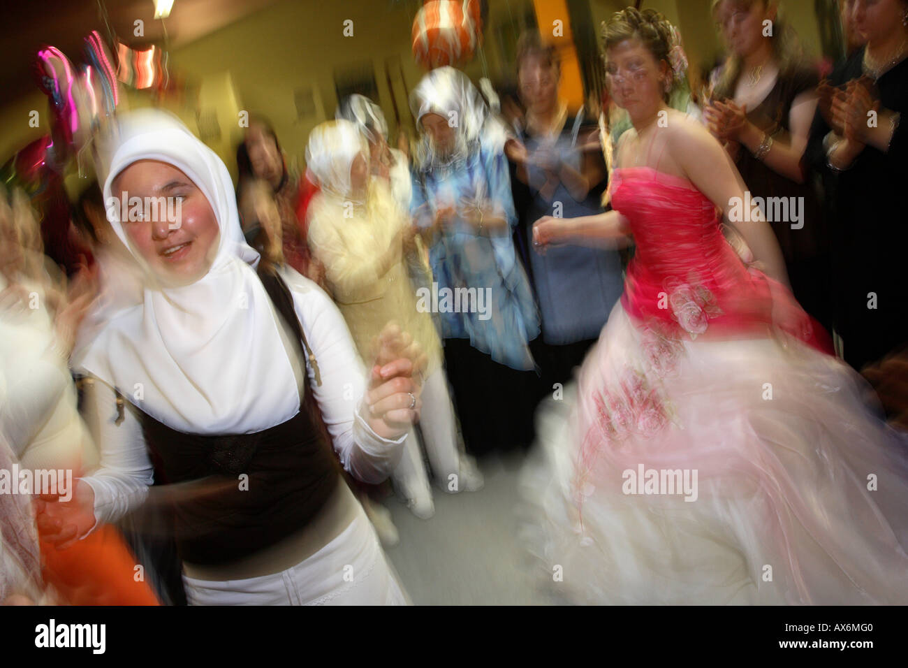 dancing bride and friends at turkish eve-of-the-wedding party. hamm, northrhine westphalia, germany, europe Stock Photo
