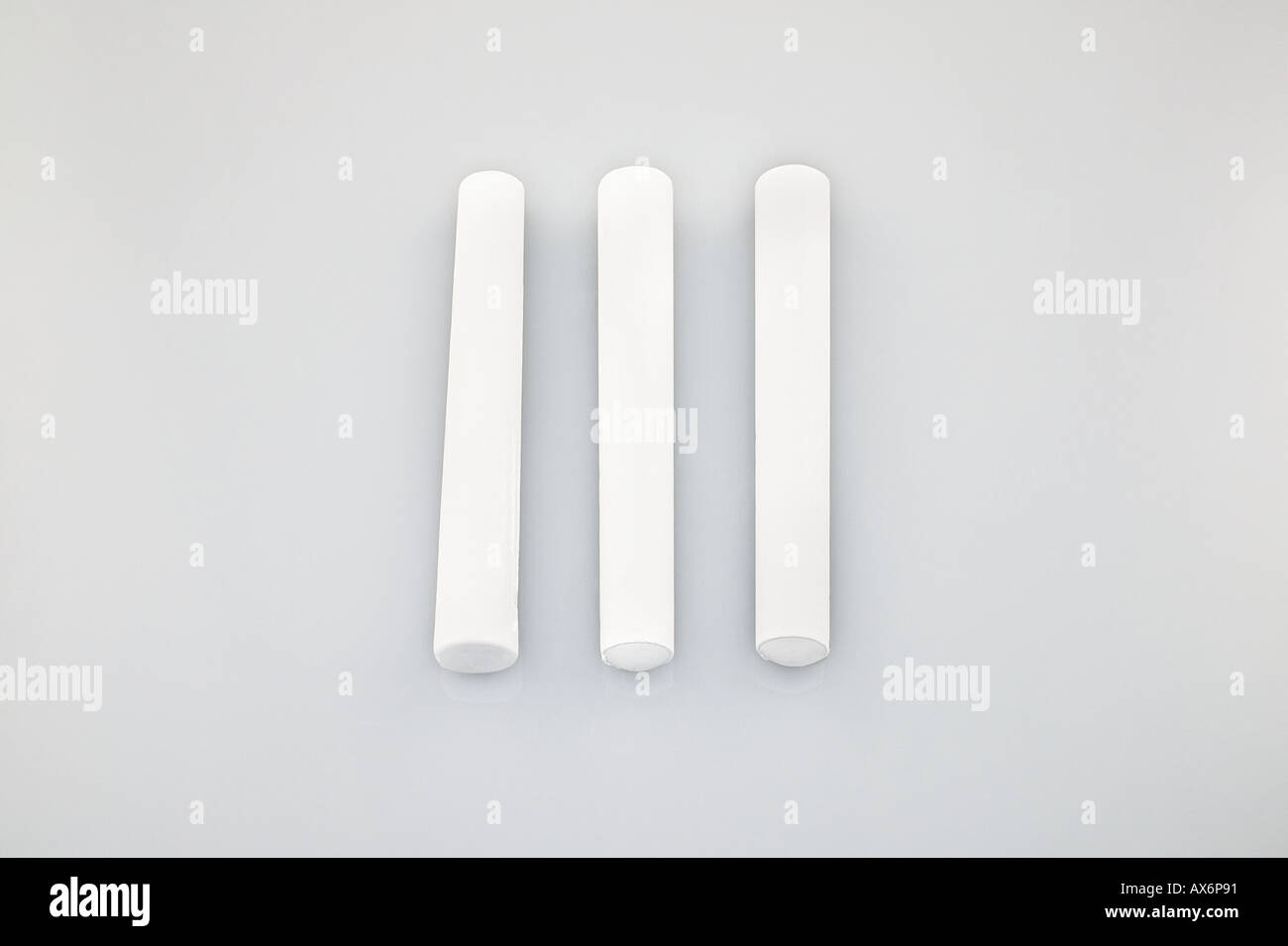 Three pieces of chalk Stock Photo Alamy