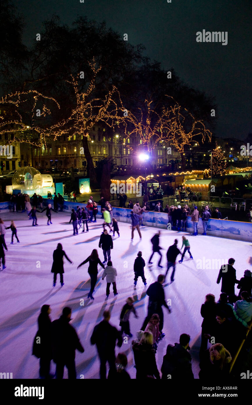 Tourists ice skating in rink National History Museum City Of London Greater London England Stock
