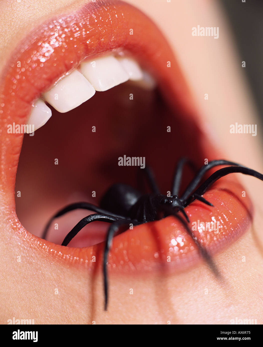 Woman with spider in her mouth Stock Photo Alamy