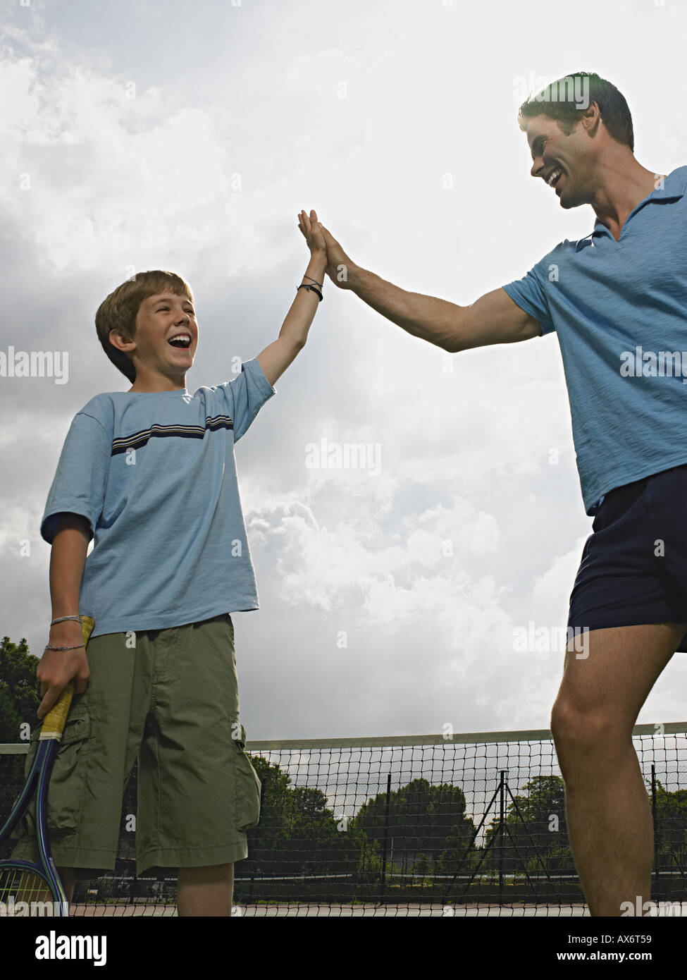 Father and son doing a high five Stock Photo