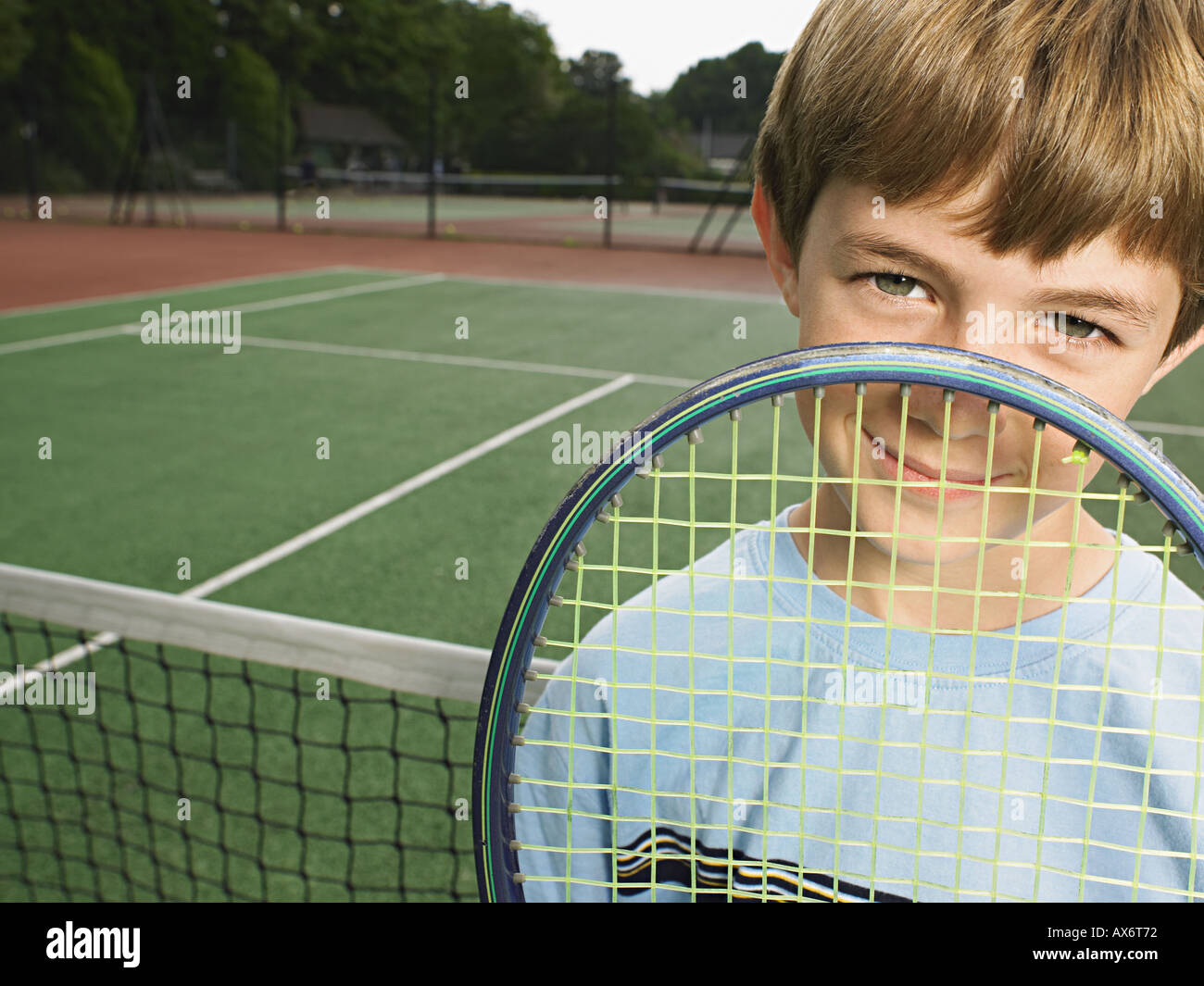 Boy with tennis racket Stock Photo