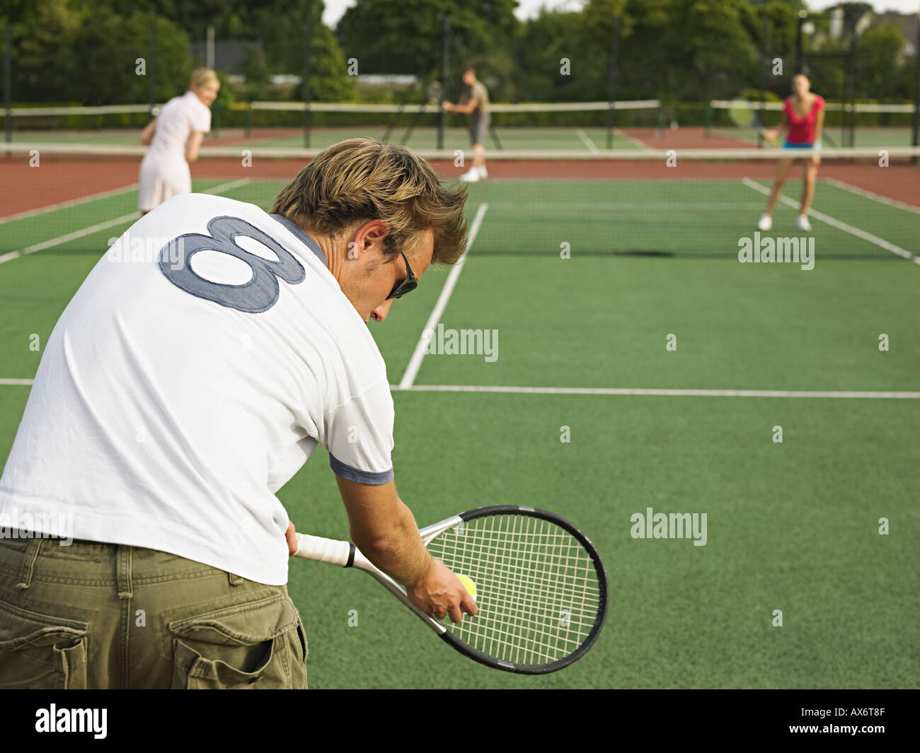 People playing tennis Stock Photo