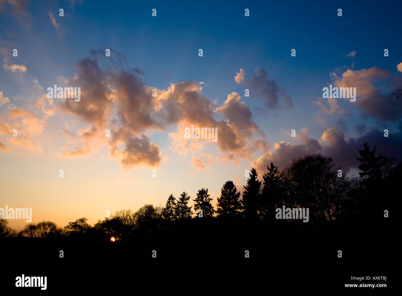 Scenic view of a colorful sunset with dramatic clouds in the sky and a ...