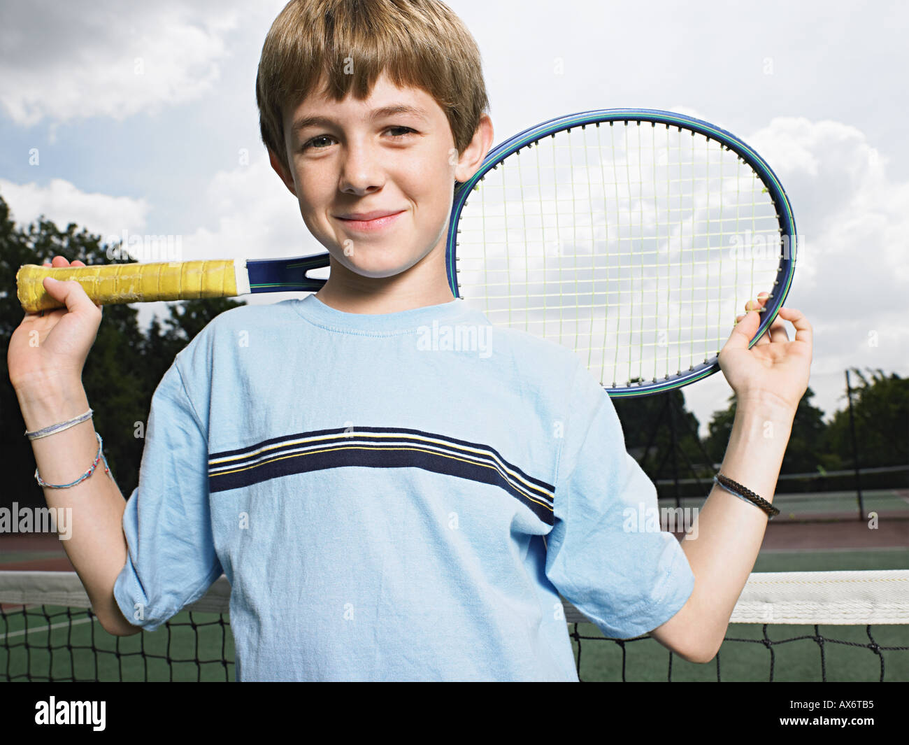 Boy holding tennis racket Stock Photo