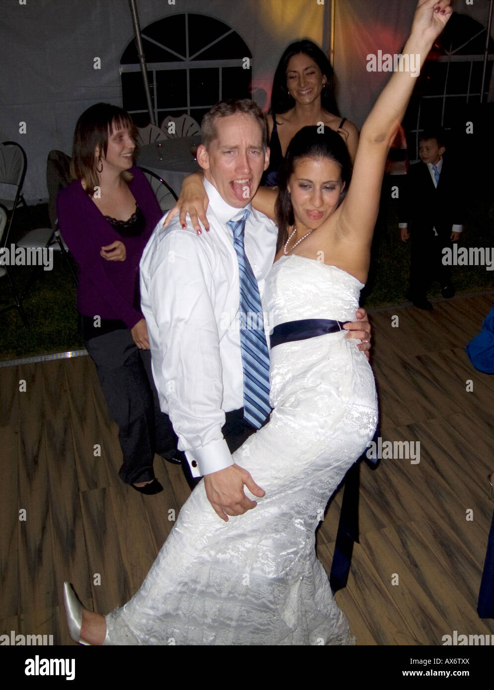 Wedded Newly wedded couple dance at their wedding reception having enjoyed ...