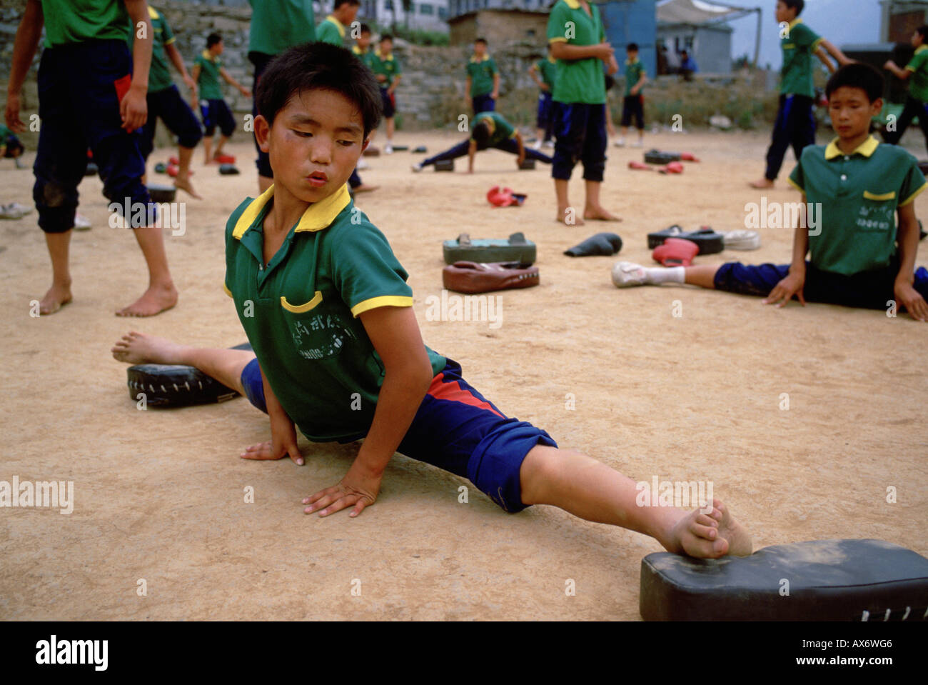 A young Chinese boy practices kung fu stretching at the Ta Gou kung Stock Photo 9570501 Alamy