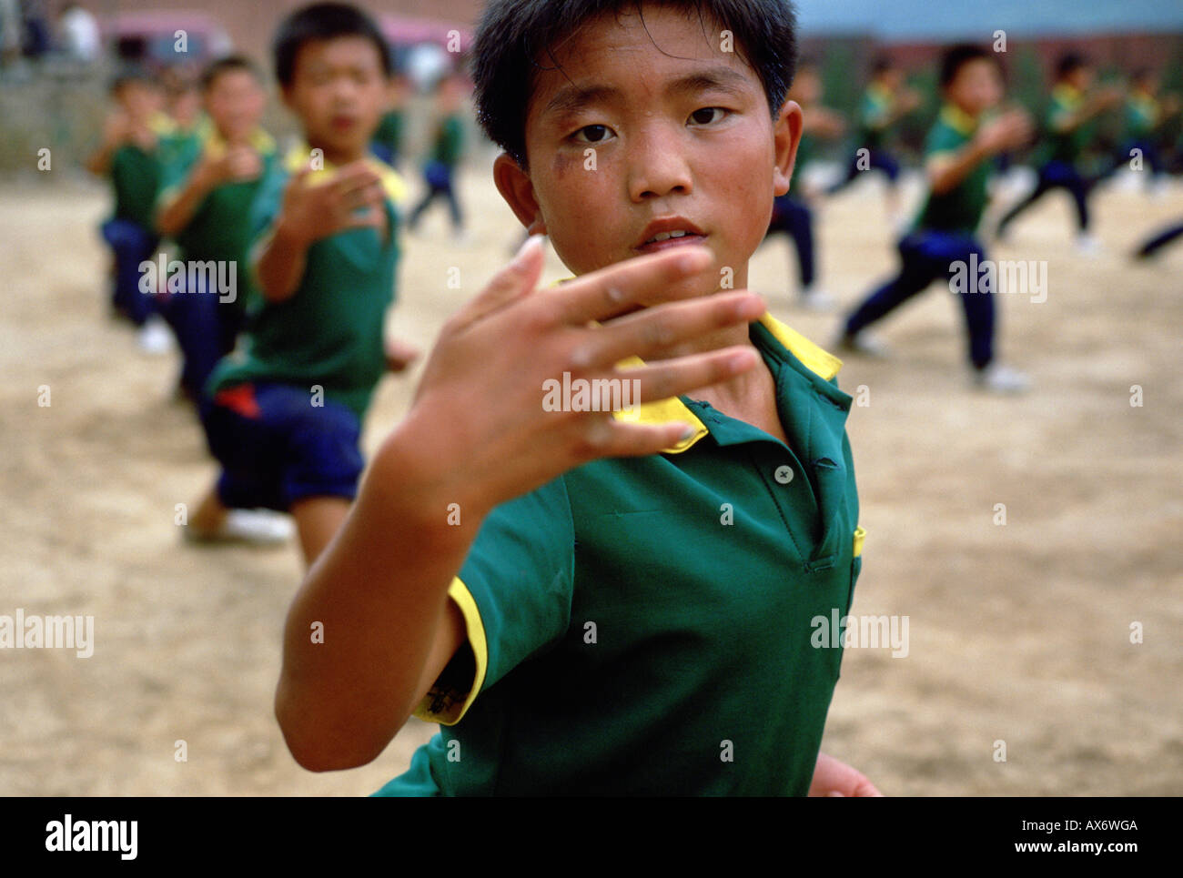 A young Chinese boy practices kung fu at the Ta Gou kung fu school in
