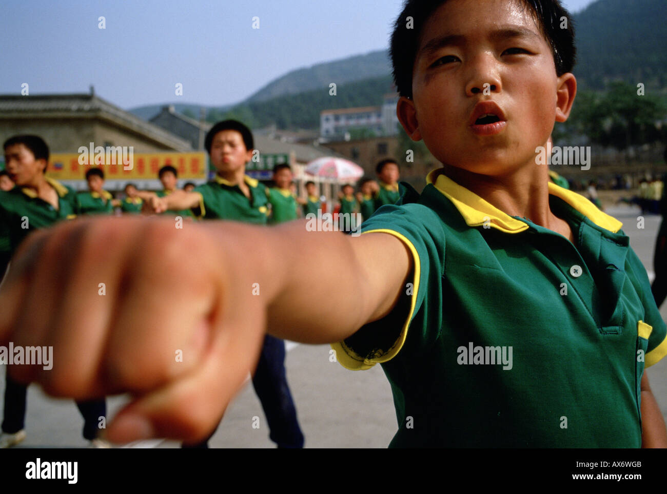 A young Chinese boy practices kung fu at the Ta Gou kung fu school in Shaolin Stock Photo Alamy