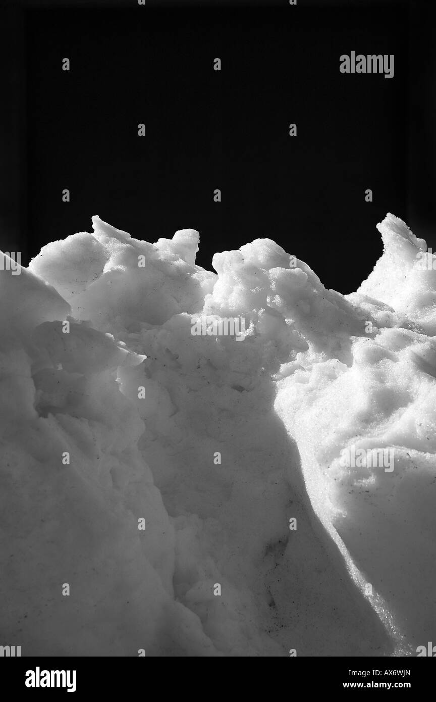 A mound of snow with black background Stock Photo