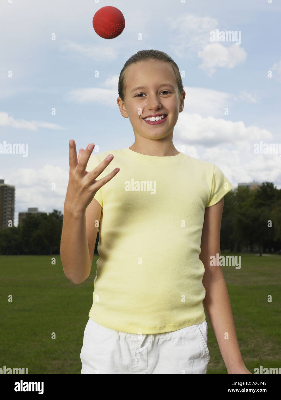 Girl throwing a ball Stock Photo Alamy
