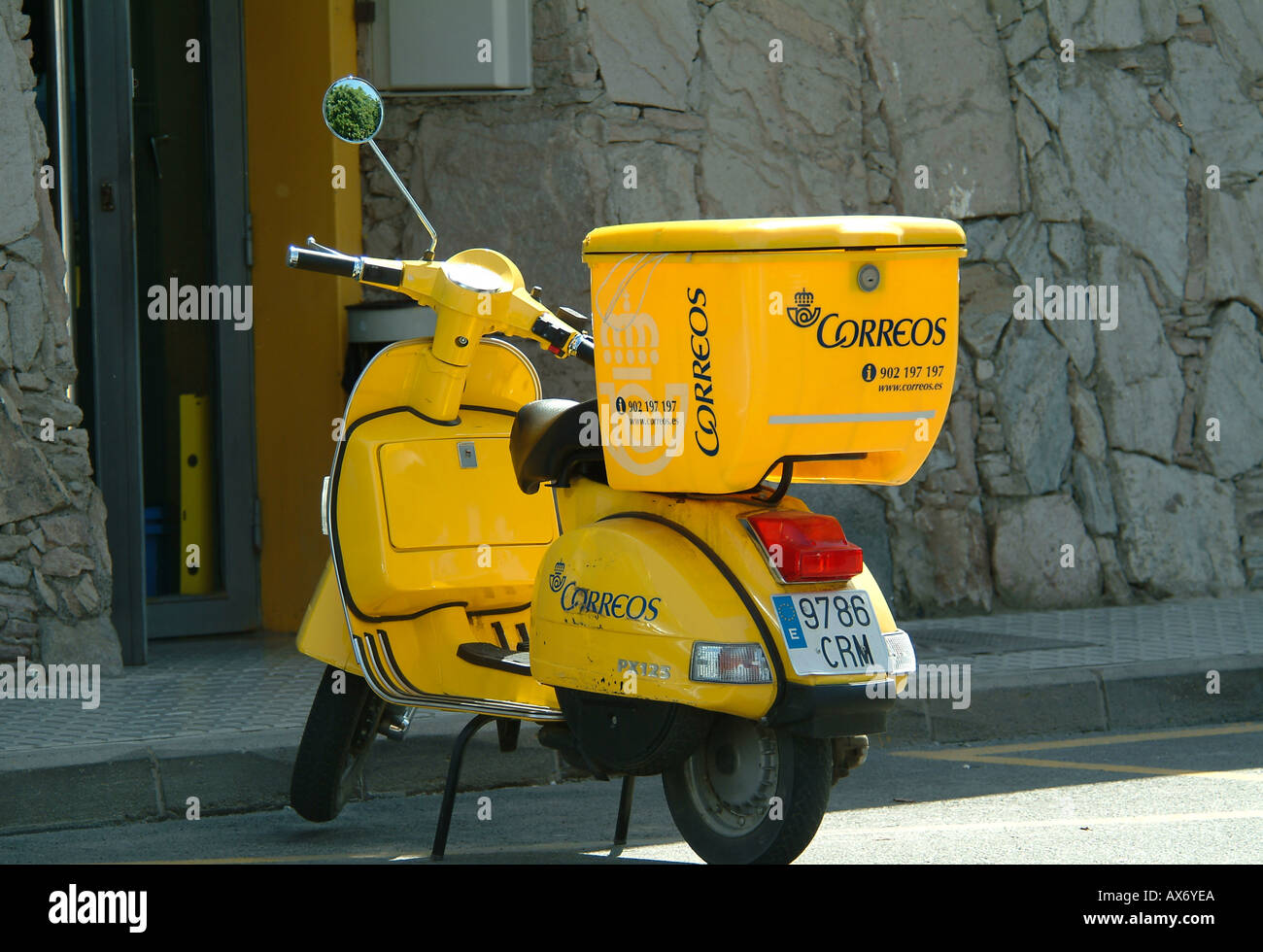 Post yellow scooter hi-res stock photography and images -