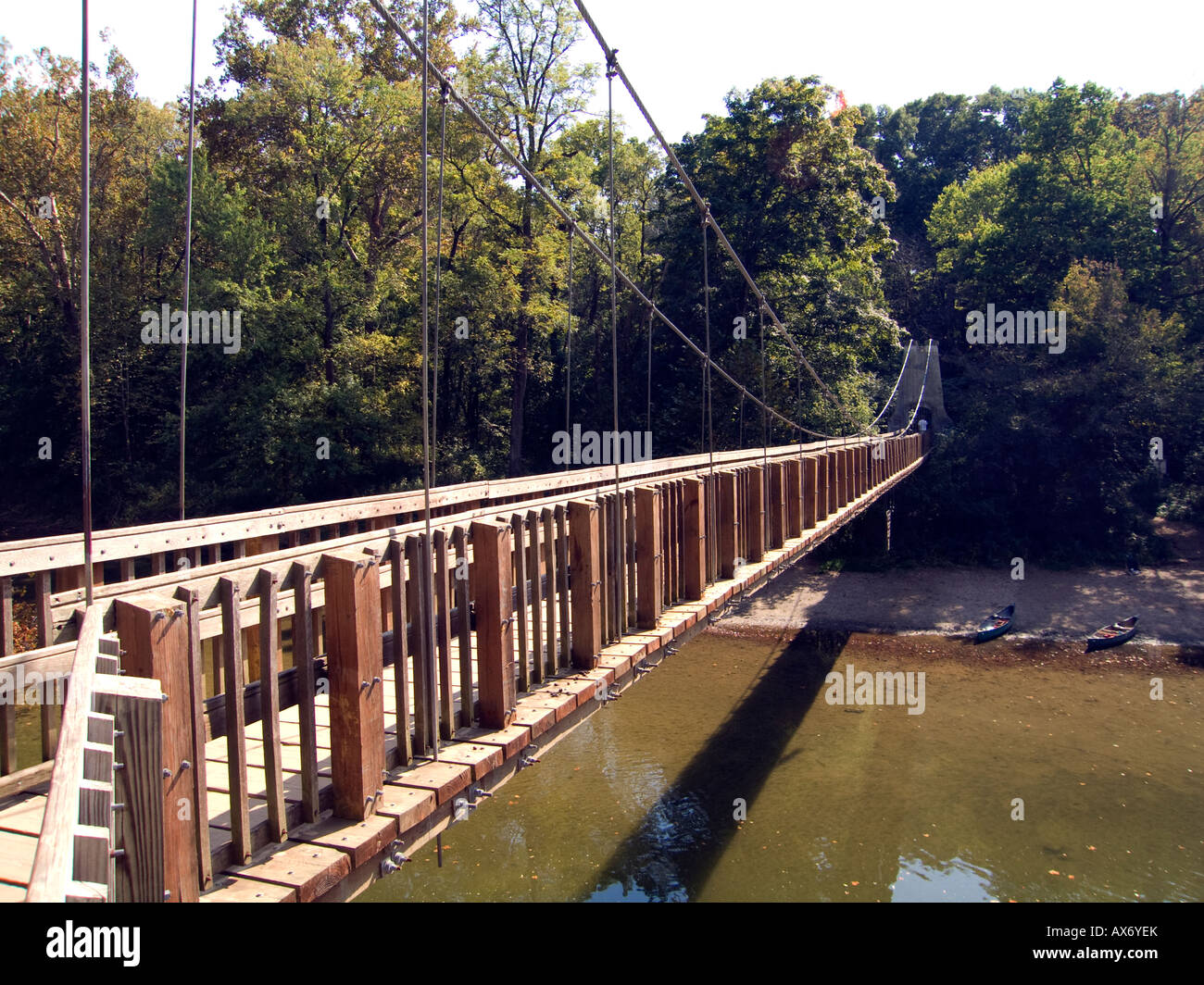 Wooden suspension bridge that leads into the Rocky Hollow Falls Canyon, over Sugar Creek in