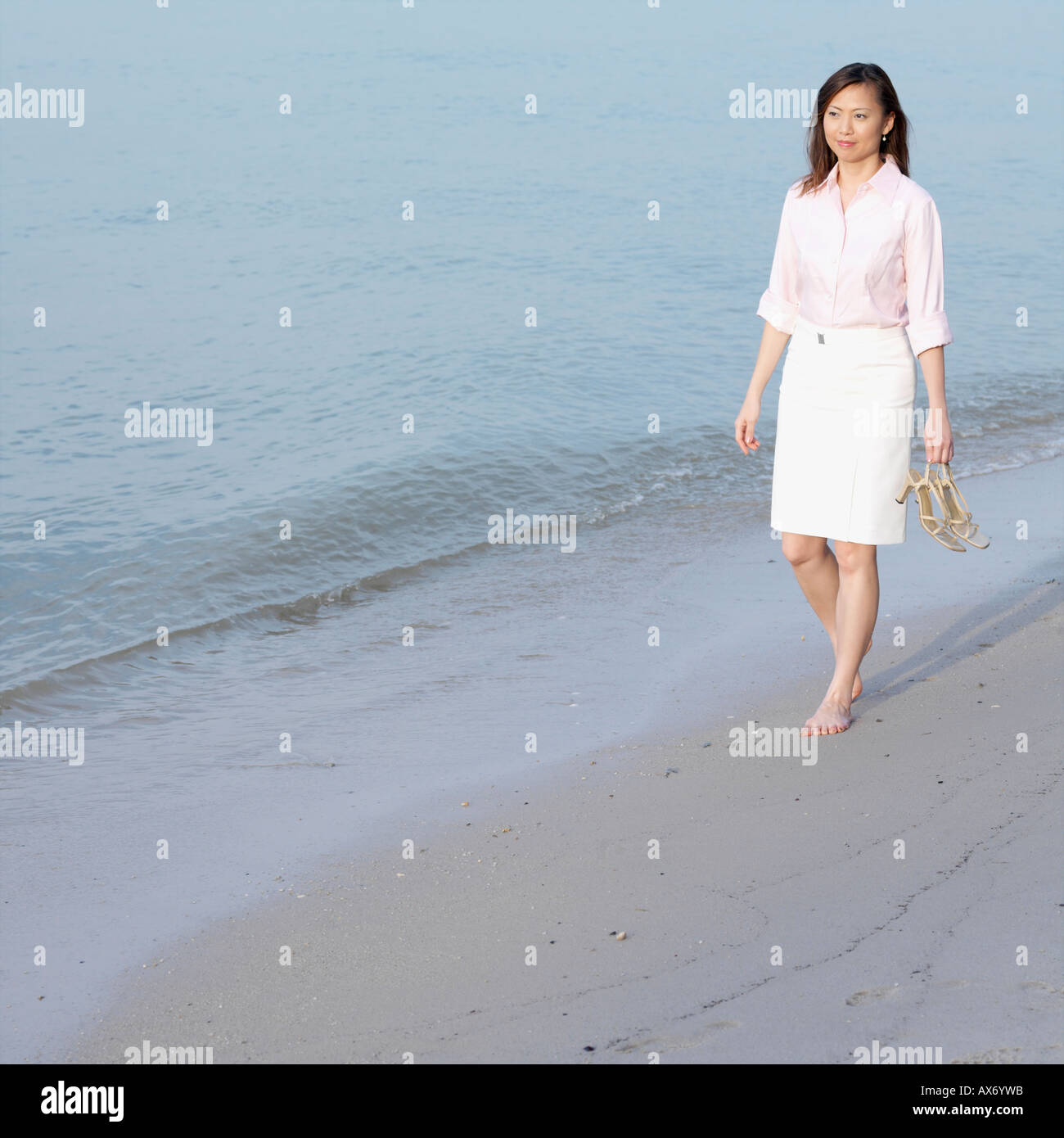 Woman long skirt walking away hi-res stock photography and images - Alamy