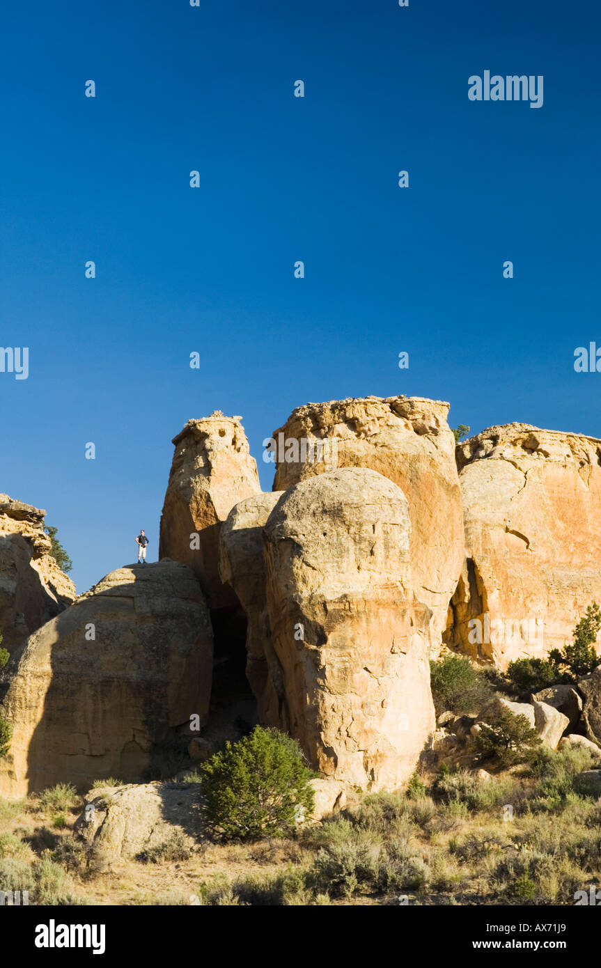 Hiker on a rock, Grand Staircase Escalante National Monument, Utah, USA Stock Photo