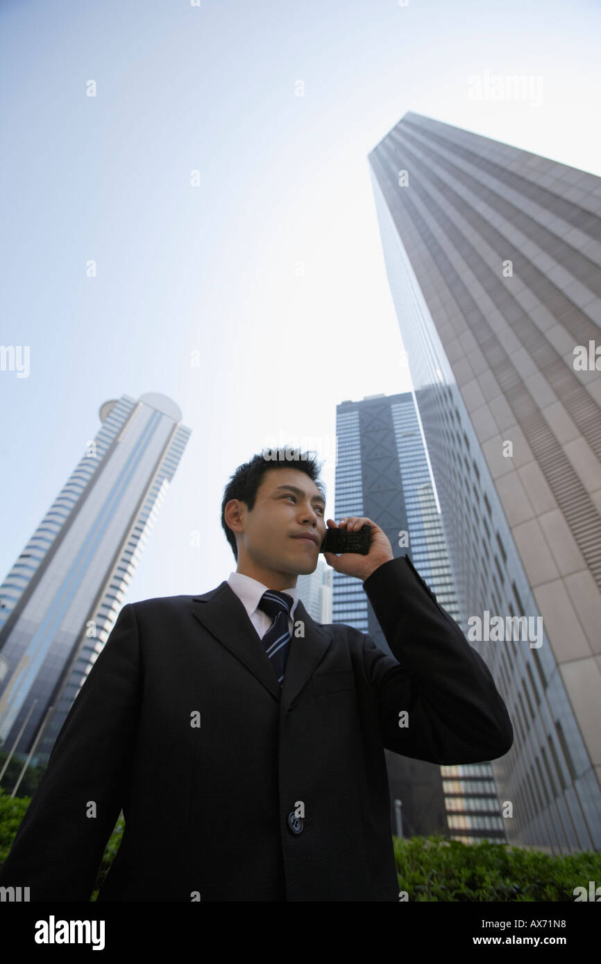 Businessman conversing on a cellphone Stock Photo