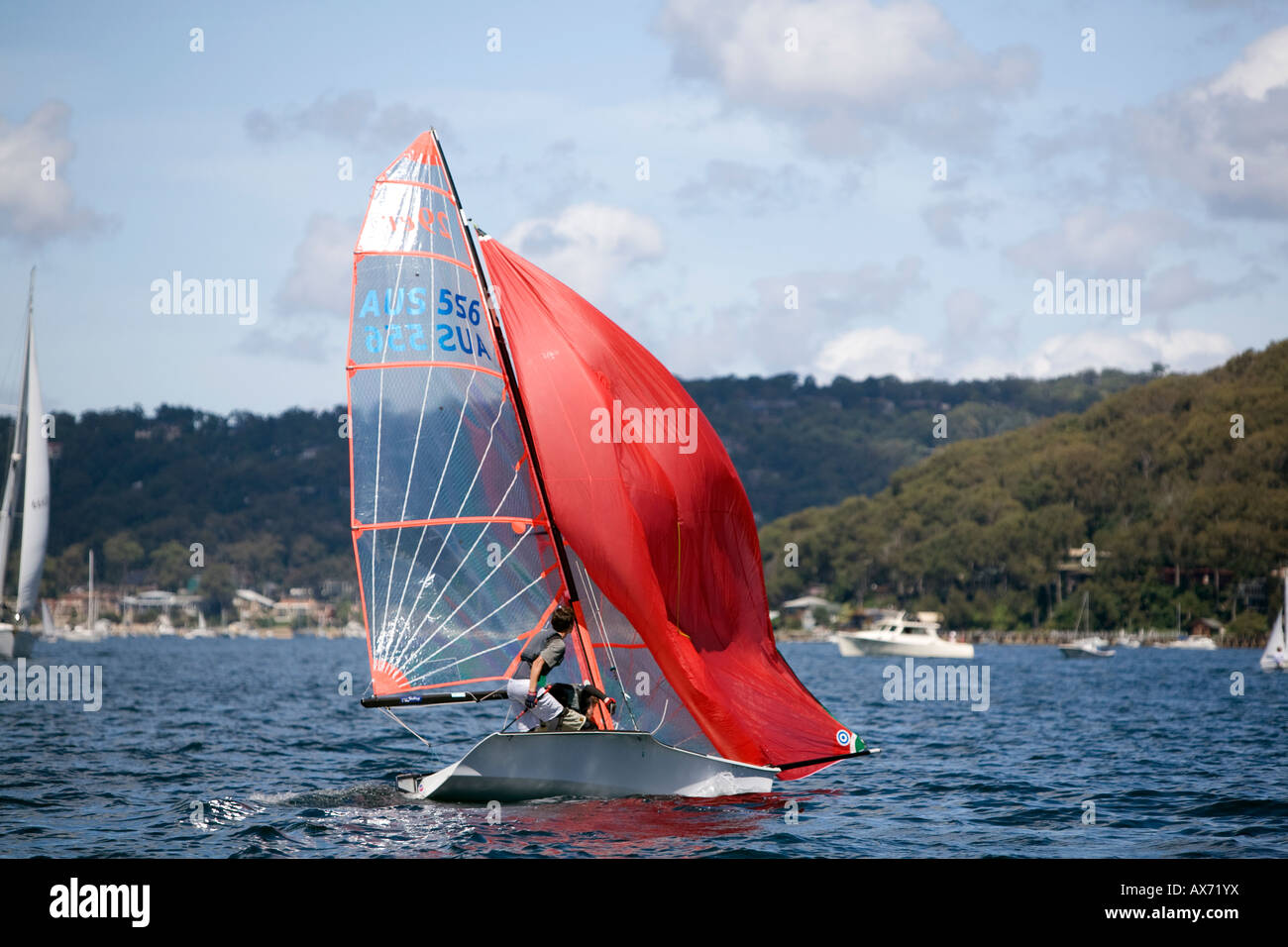 two young boys sailing their dinghy on Pittwater,Sydney Stock Photo