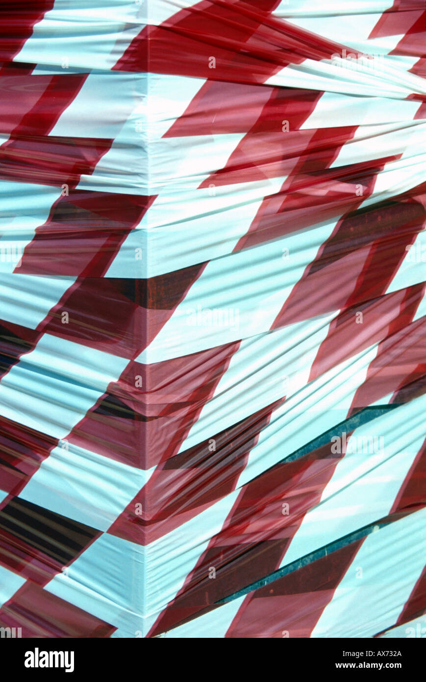 red and white warning tape wrapped around bollard Stock Photo Alamy