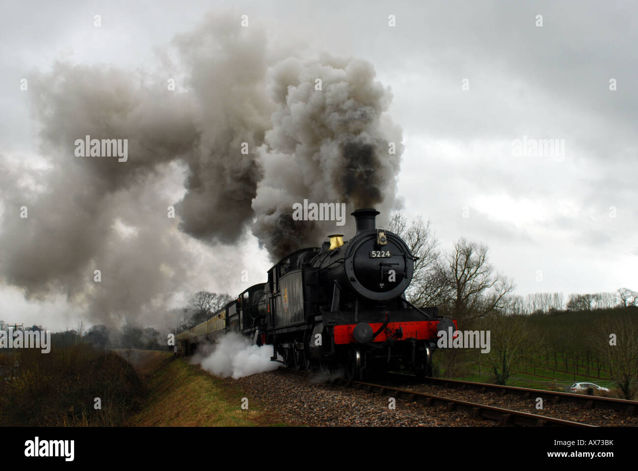 engine 5224 in full steam through the Somerset countryside on the West Somerset Railway between Bishops Lydeard and Minehead WSR Stock Photo