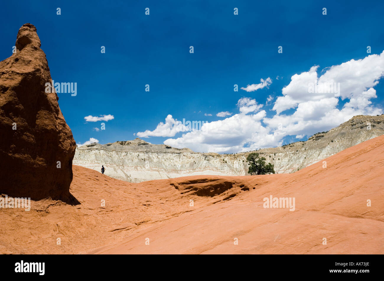 Lone walker traverses a sandstone ridge, Kodachrome Basin State Park ...