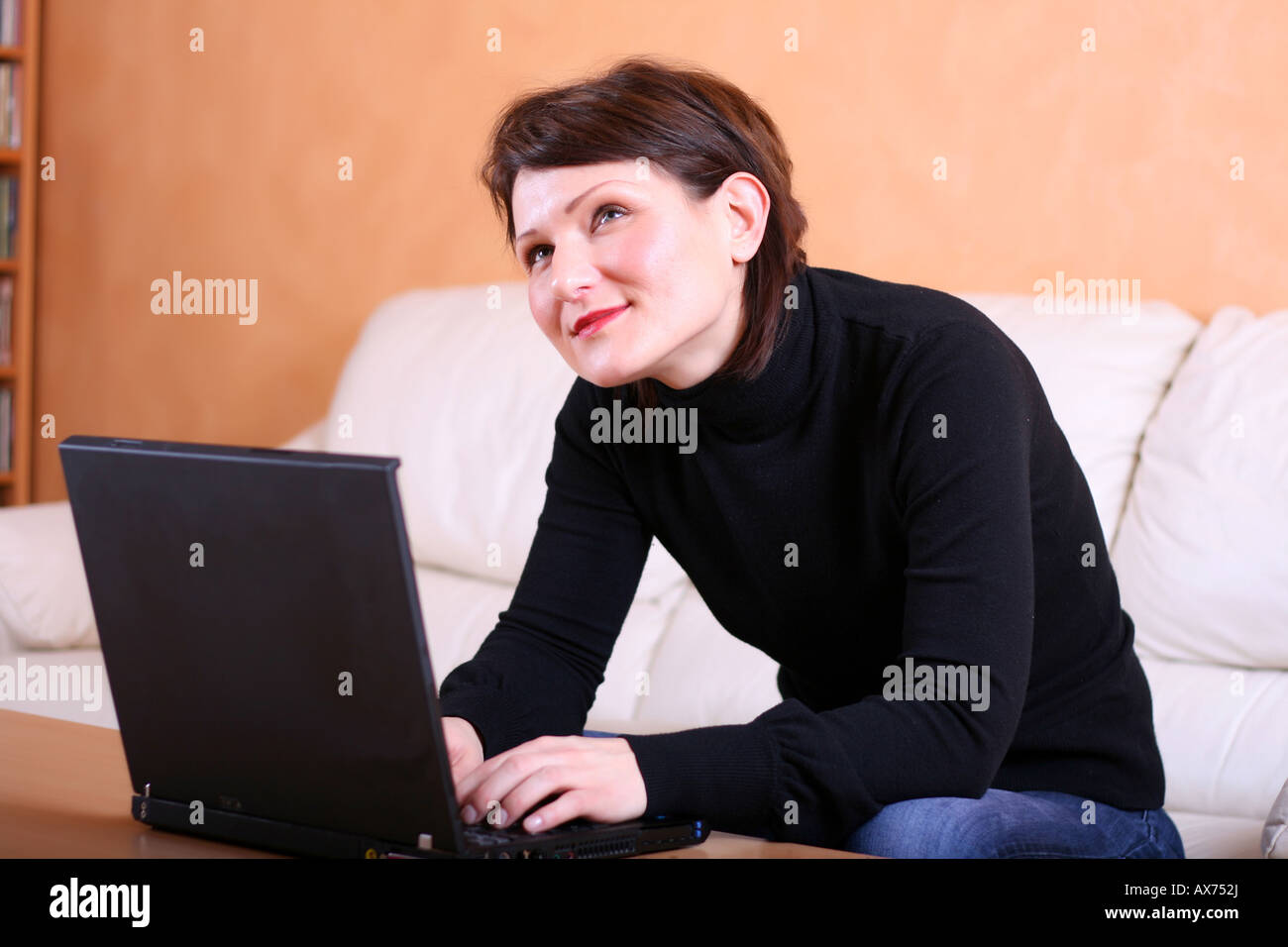 Young lady with a computer Stock Photo - Alamy