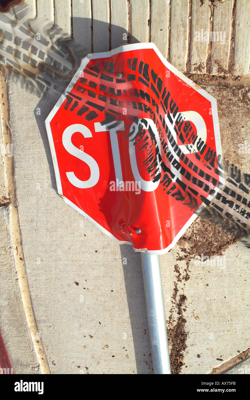car tire treads running over stop sign Stock Photo Alamy