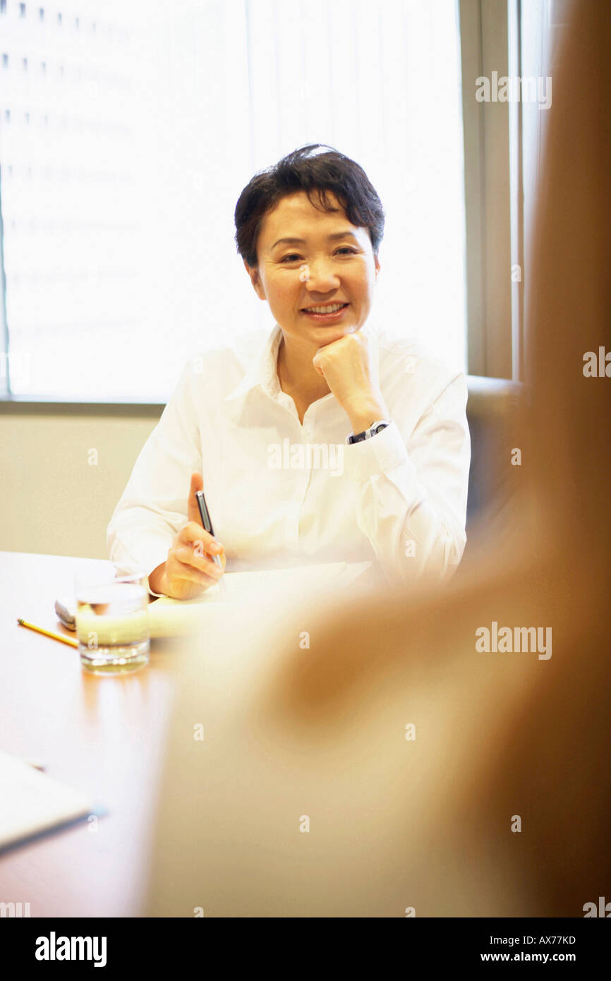 Businesswoman looking at another businesswoman Stock Photo