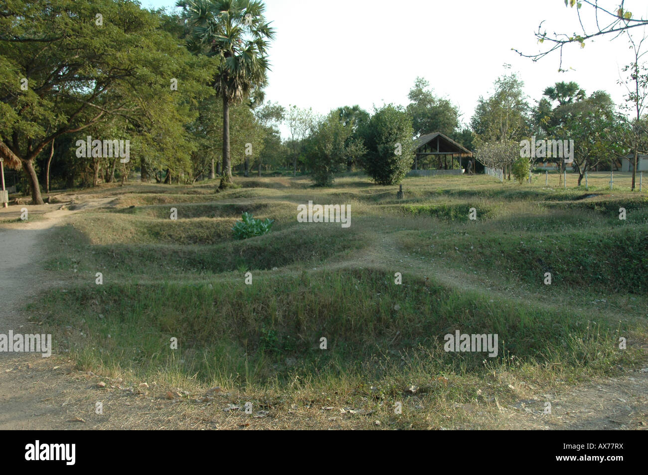 Excavated mass graves at The Killing Fields, Choeung Ek, Nrar Phnom Penh, Cambodia. Stock Photo