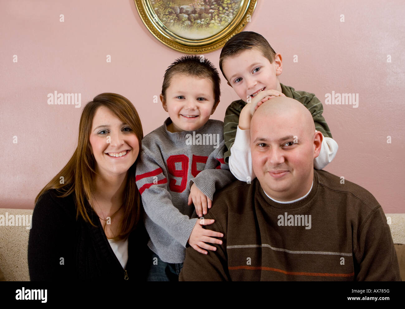 A connecticut family with two small boys. The father has cancer and is going through chemotherapy and has no hair. Stock Photo