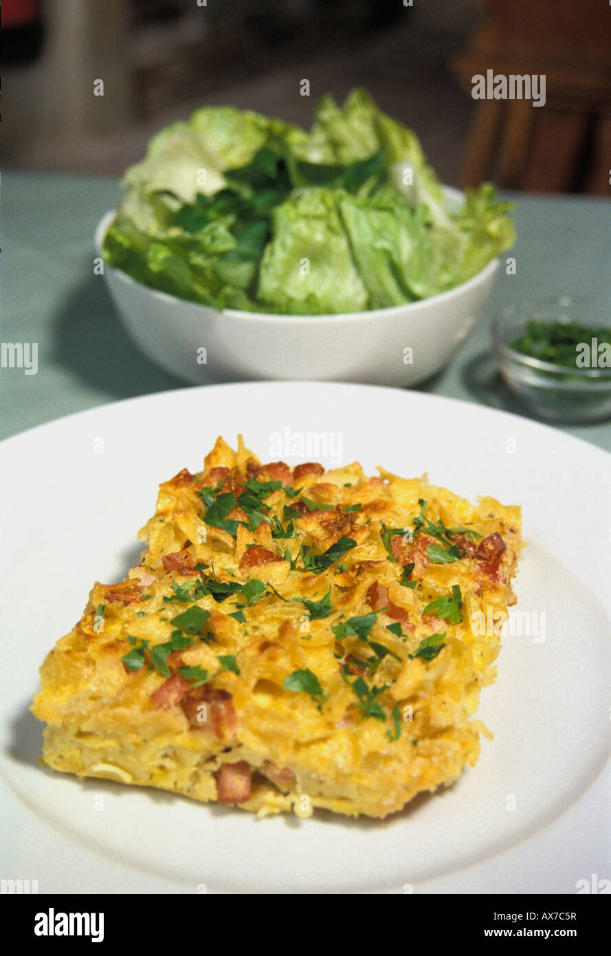Baked Schinkenfleckerln with salad Stock Photo - Alamy