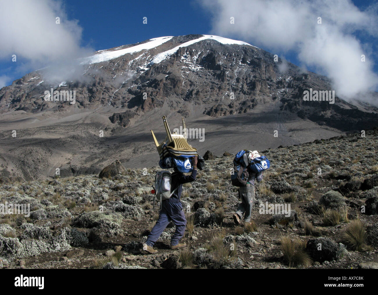 Porters on Mount Kilimanjaro in Northern Tanzania, highest Mountain In Africa. One of the seven highest mountains in the World Stock Photo