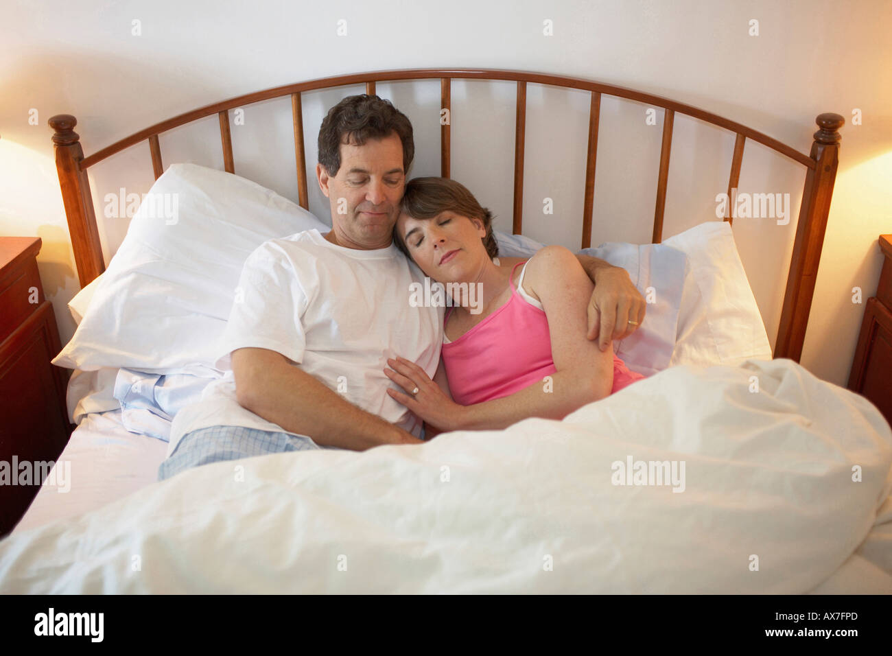High angle view of a mid adult couple sleeping in the bed Stock Photo ...