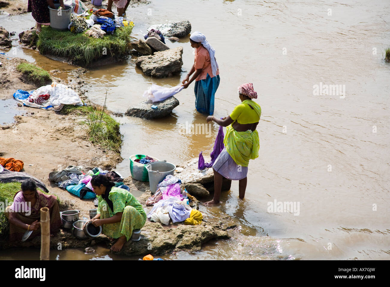 Women washing clothes in a river, Tamil Nadu, India Stock Photo