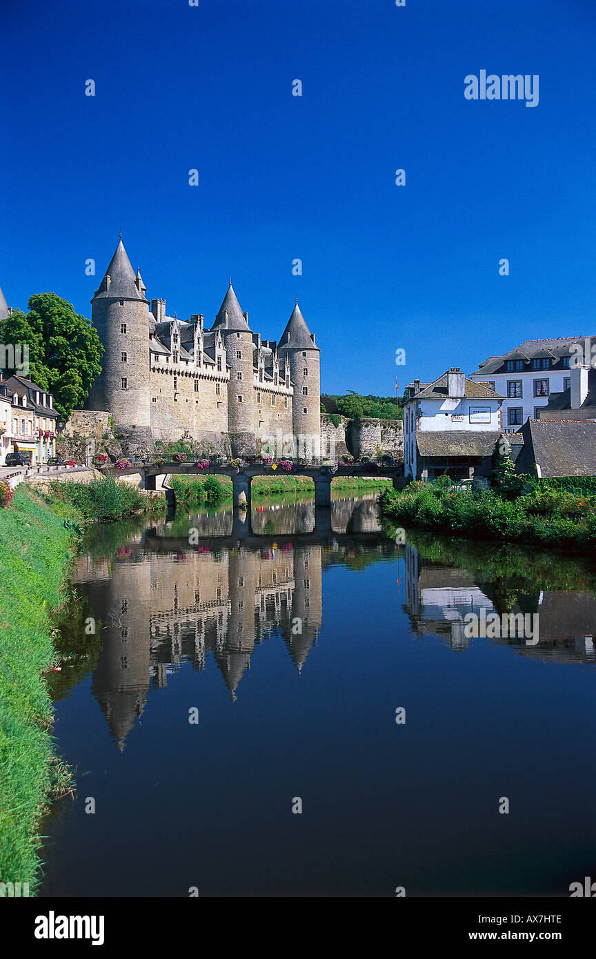 Chateau Josselin at a canal under blue sky, Morbihan, Brittany, France, Europe Stock Photo