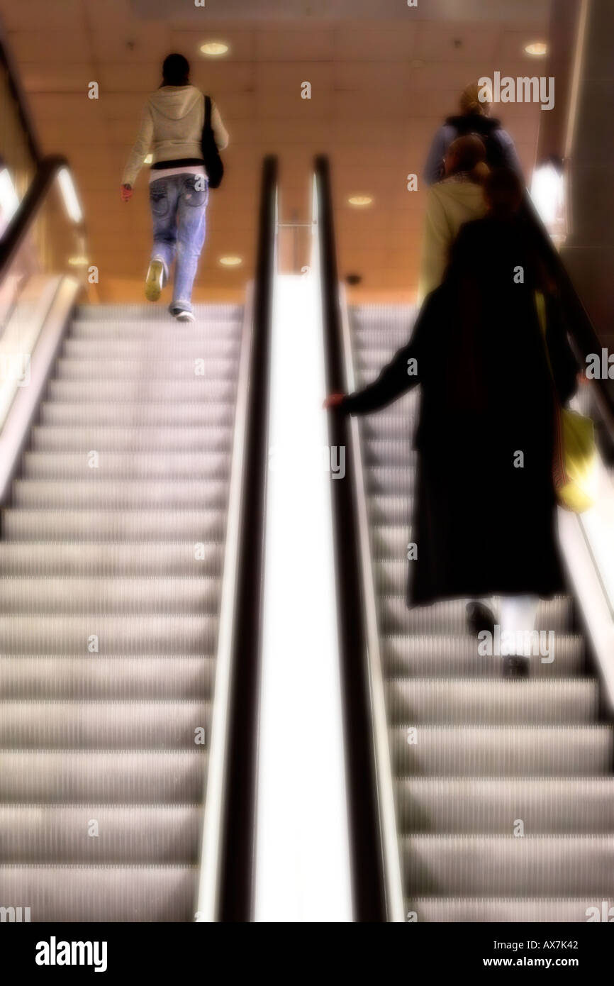 Women on escalator Stock Photo Alamy