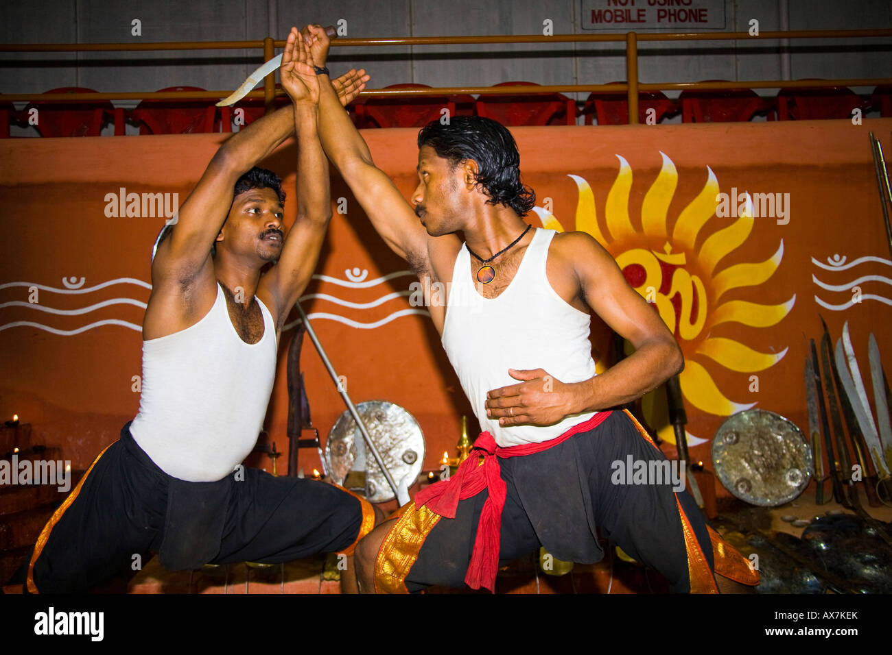 Kalarippayattu martial arts performers fighting, Kerala Kalari Stock