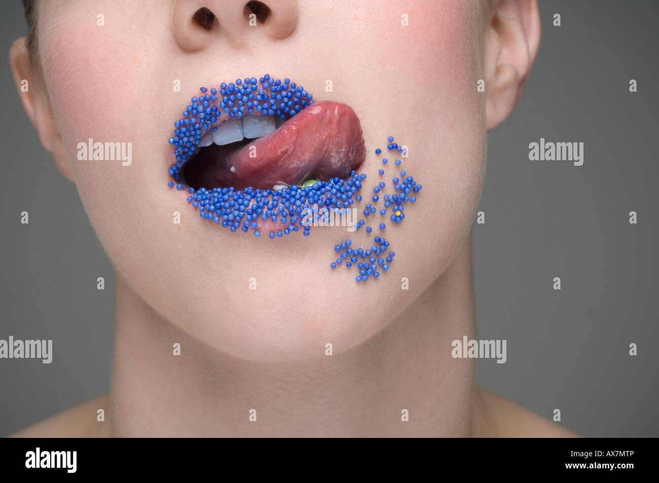 Woman Licking Sprinkles Off Lips Stock Photo Alamy