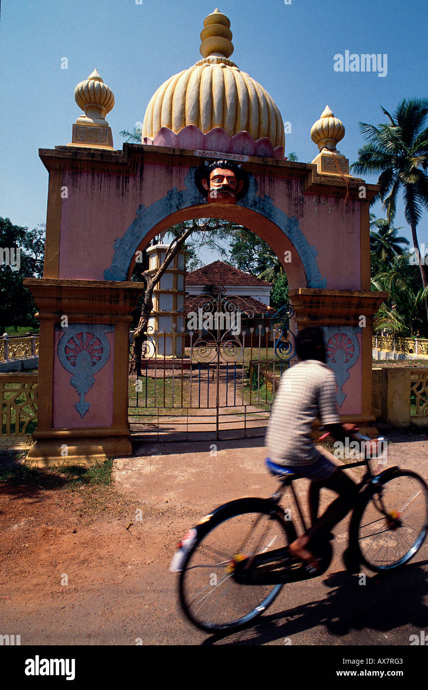 Cyclist in front of a Hindu Temple, Margao, Goa, India Stock Photo Alamy
