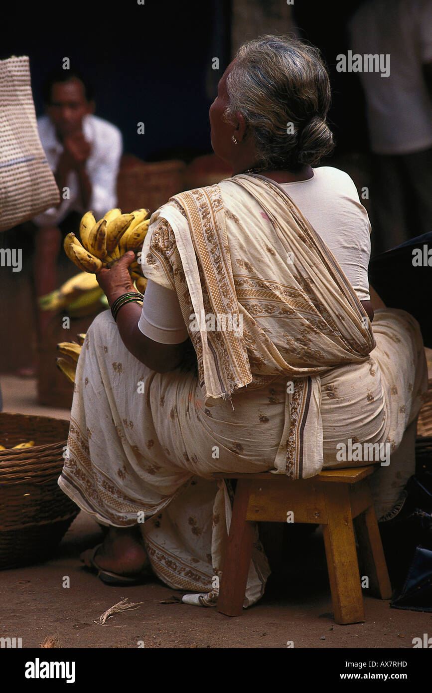 Mature woman selling bananas at the market, Mapusa, Goa, India Stock Photo