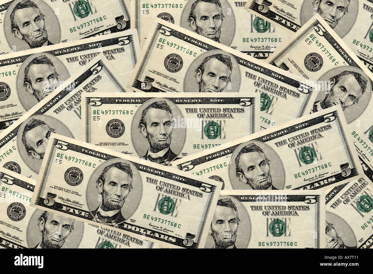 A pile of American 5 Dollar bills Stock Photo
