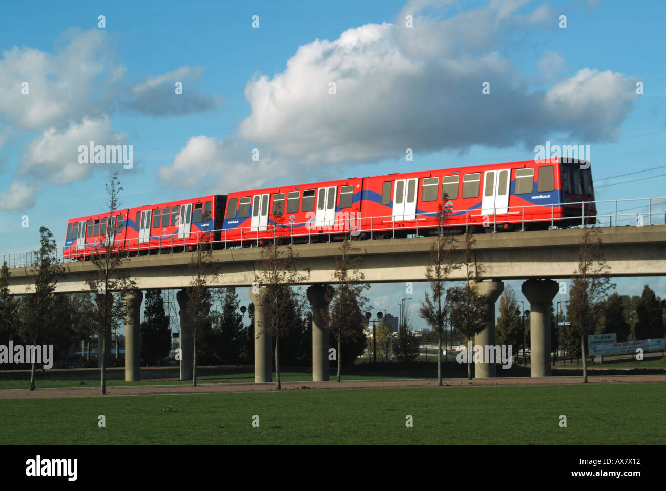 East London train on elevated section of the Docklands Light Railway Beckton branch line Stock Photo