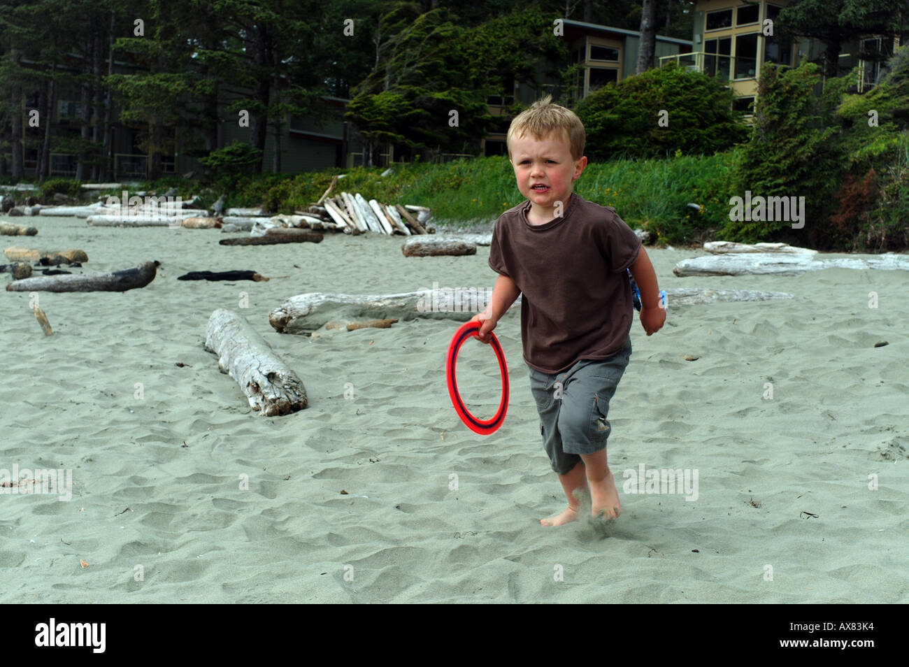 Boy playing frizbee Stock Photo - Alamy