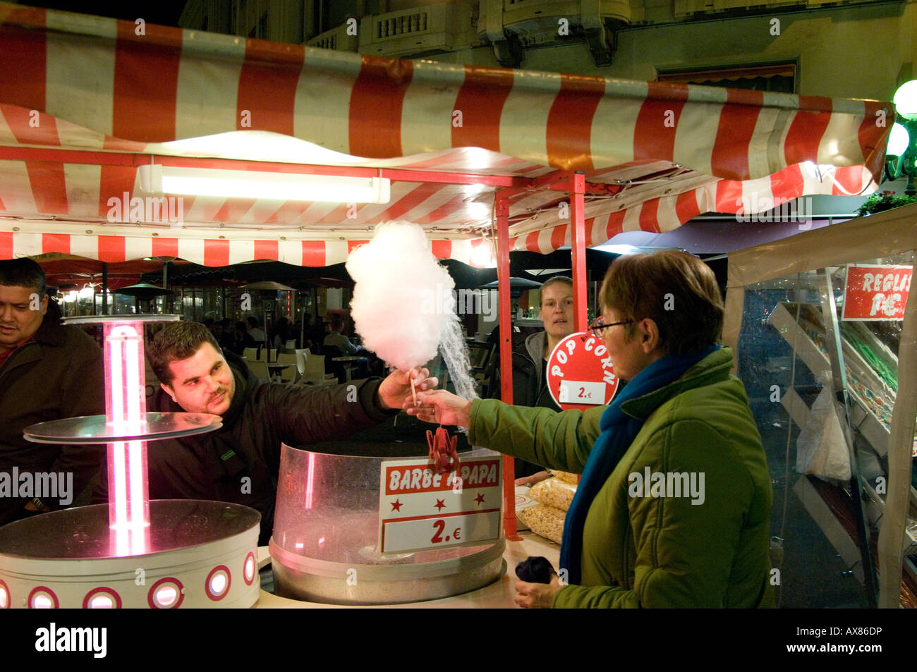 vokal tykkelse til stede Nice Cote d'Azur France - A woman buying candy floss at Nice Carnival on  the Cote d'Azur France - the French Riviera Stock Photo - Alamy