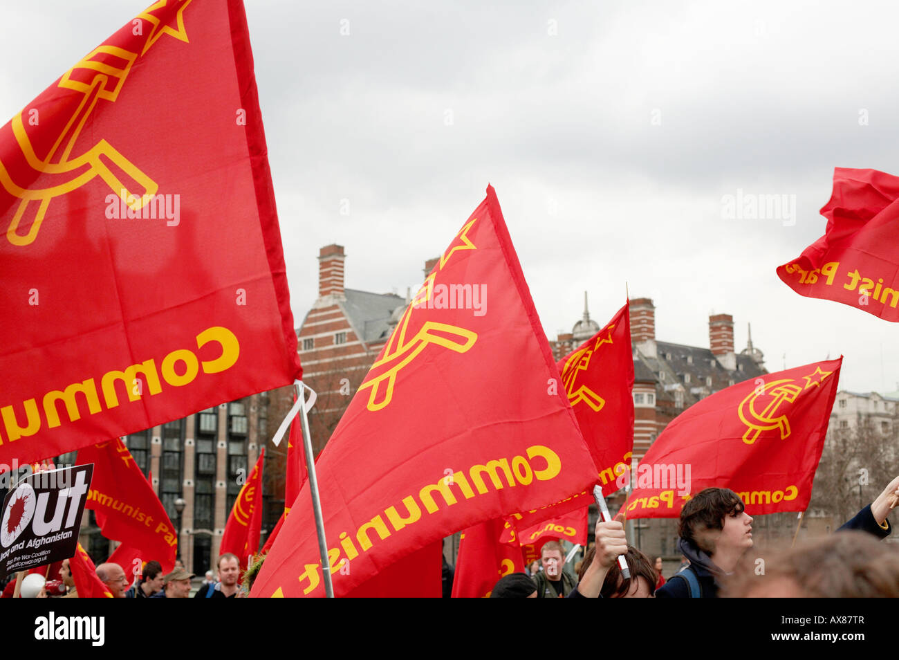 Communist flags waving at an Anti War rally in London UK Stock Photo