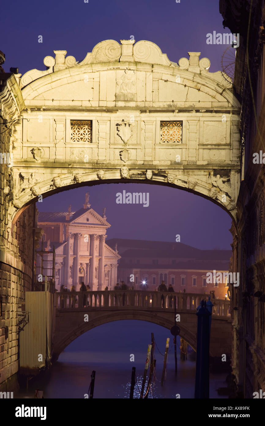 Bridge of Sighs with San Giorgio Maggiore in b gd Venice Italy at twilight Stock Photo