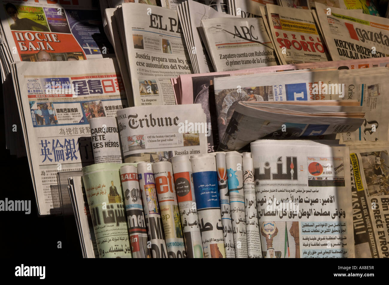 International newspapers ranging from Russian to Arabic on sale at newspaper stand in Ealing W5 London United Kingdom Stock Photo